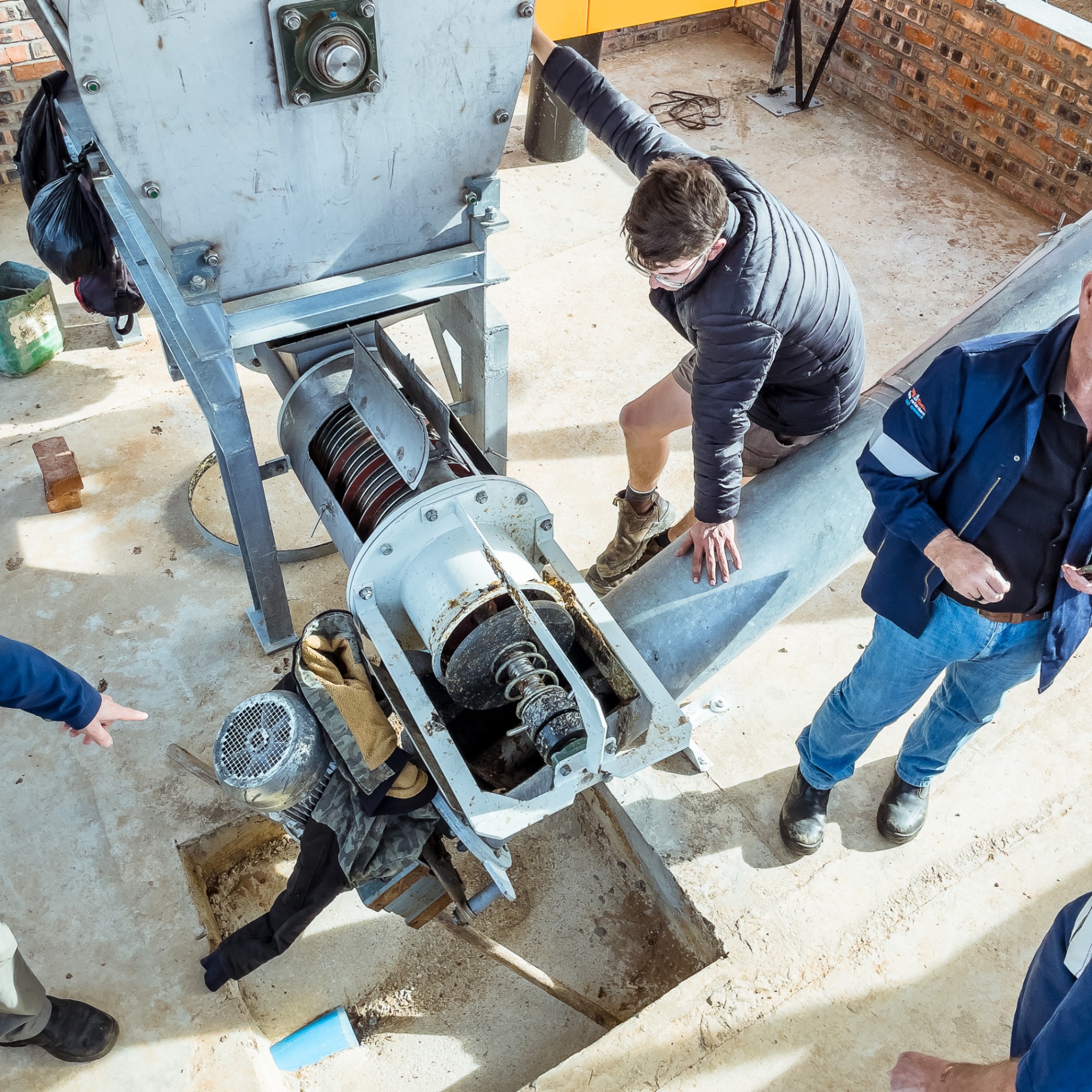 Overhead view of Turn-Rite technicians installing industrial drive equipment